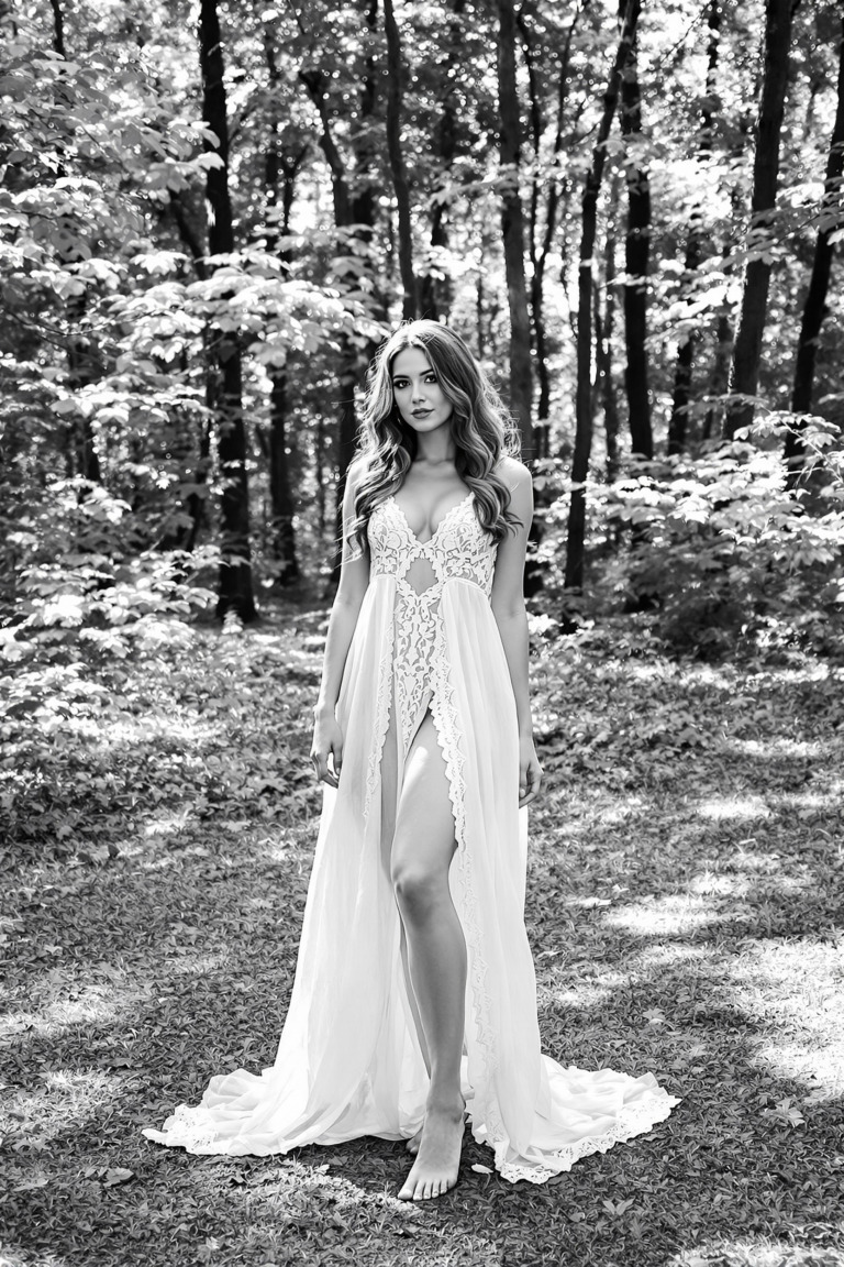 Free CC0 public domain image of a woman standing barefoot in a serene forest clearing